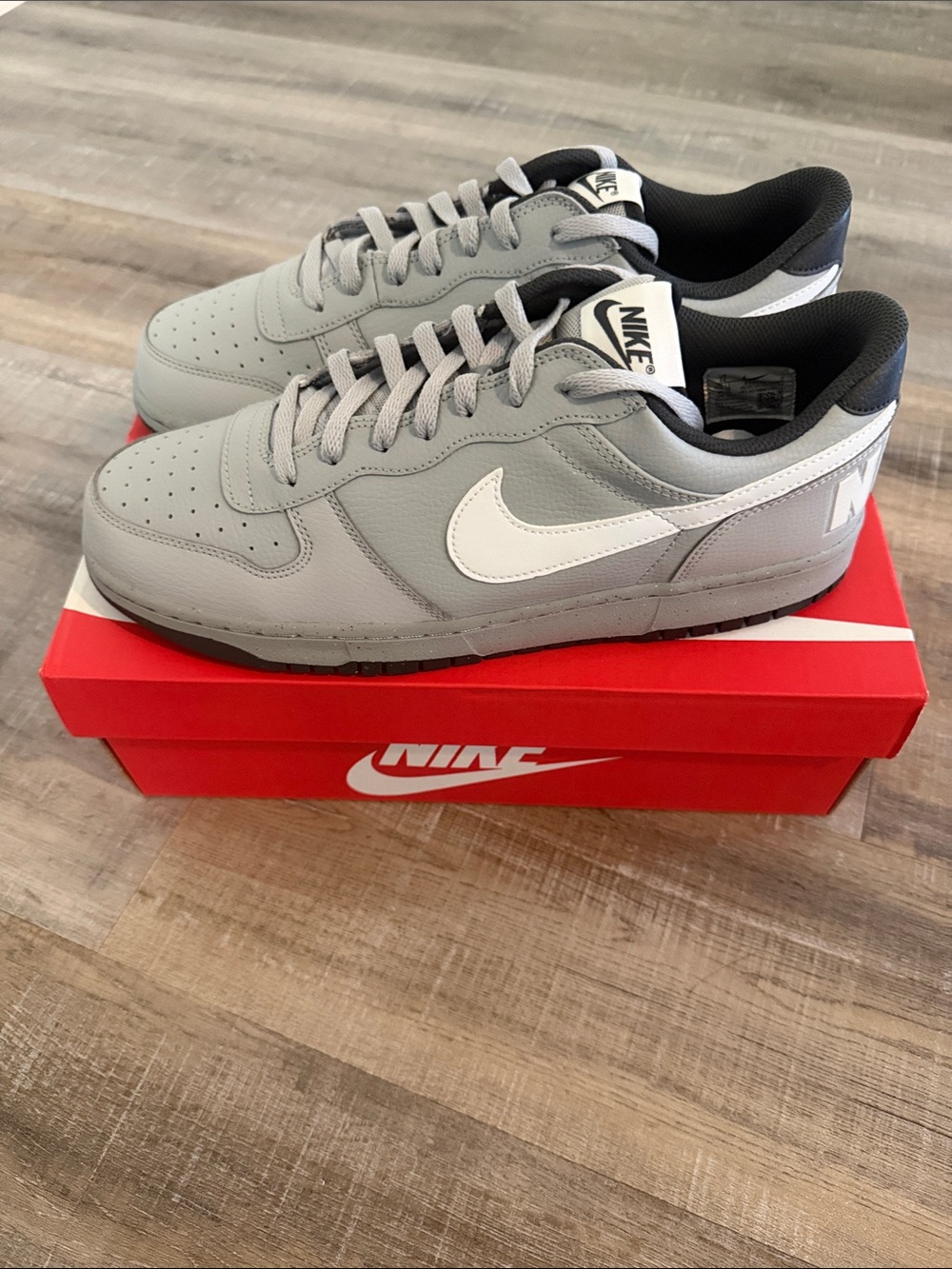 Nike Grey Low-Top Sneakers with White Swoosh